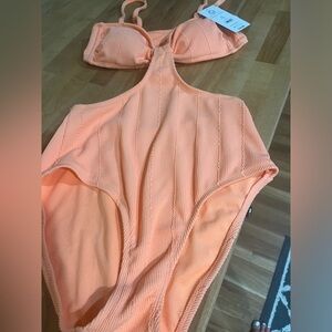 New with tags one piece bathing suit size 7-9, medium